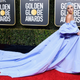 Illustration for article titled Class Warfare! Lady Gaga's Golden Globes Dress Listed at Auction by Hotel Housekeeper Claiming She 'Found It'